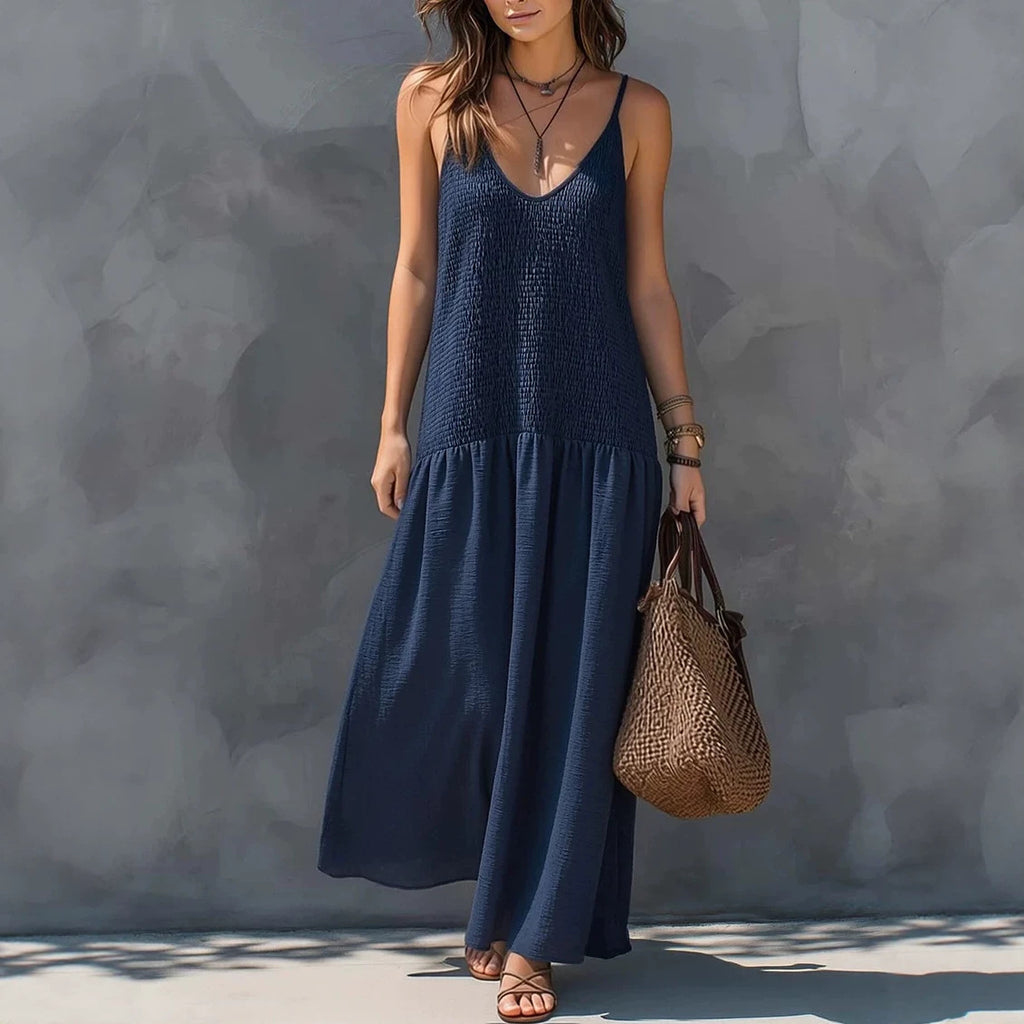 Navy blue tiered maxi dress with V-neck spaghetti straps and sleeveless bodice