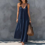 Navy blue tiered maxi dress with V-neck spaghetti straps and sleeveless bodice