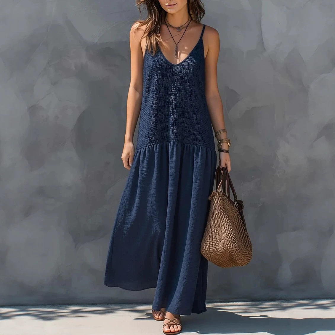 Navy blue tiered maxi dress with V-neck spaghetti straps and sleeveless bodice