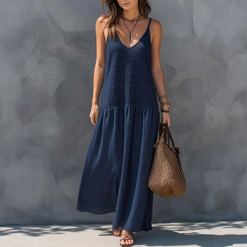 Navy blue tiered maxi dress with V-neck spaghetti straps and sleeveless bodice