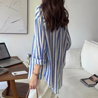 Blue and white striped long-sleeve button-up shirt, straight back view with collar and hem
