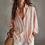 Striped oversized button-up shirt in pink and white, long sleeves, front button placket