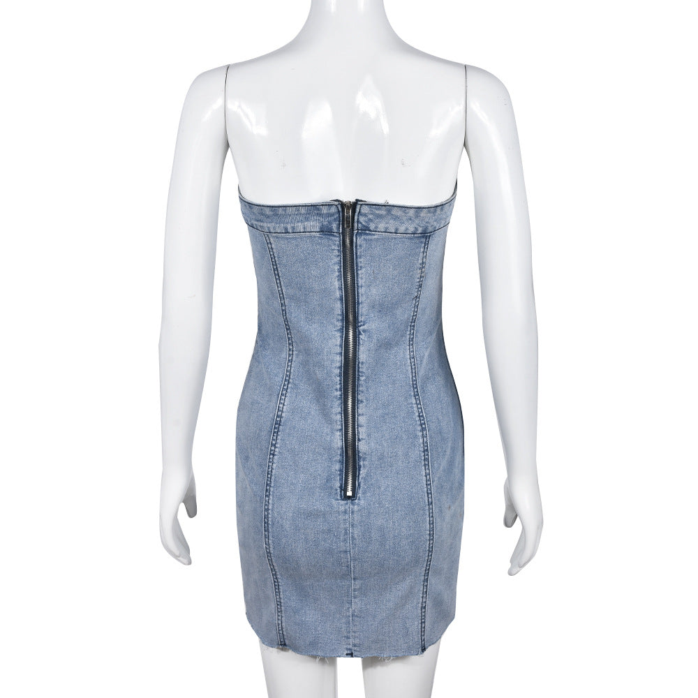 Backless light blue denim mini dress on mannequin with center back seam detail