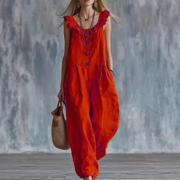 Orange-red sleeveless button-down jumpsuit with ruffled neckline and front buttons