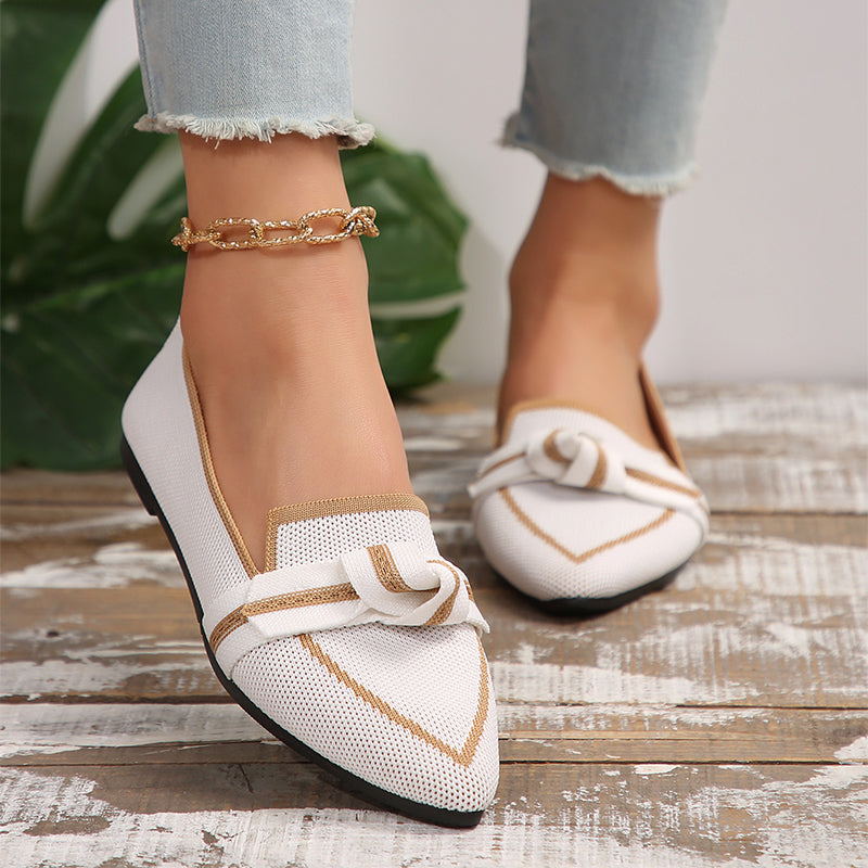 Milky white woven bow pointed toe flats with tan trim and elastic-style strap