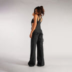 Black denim zipper overalls side view with suspender straps, wide legs, patch pockets