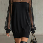 Black mini dress with sheer sleeves, ribbed cuffs, and pullover knit
