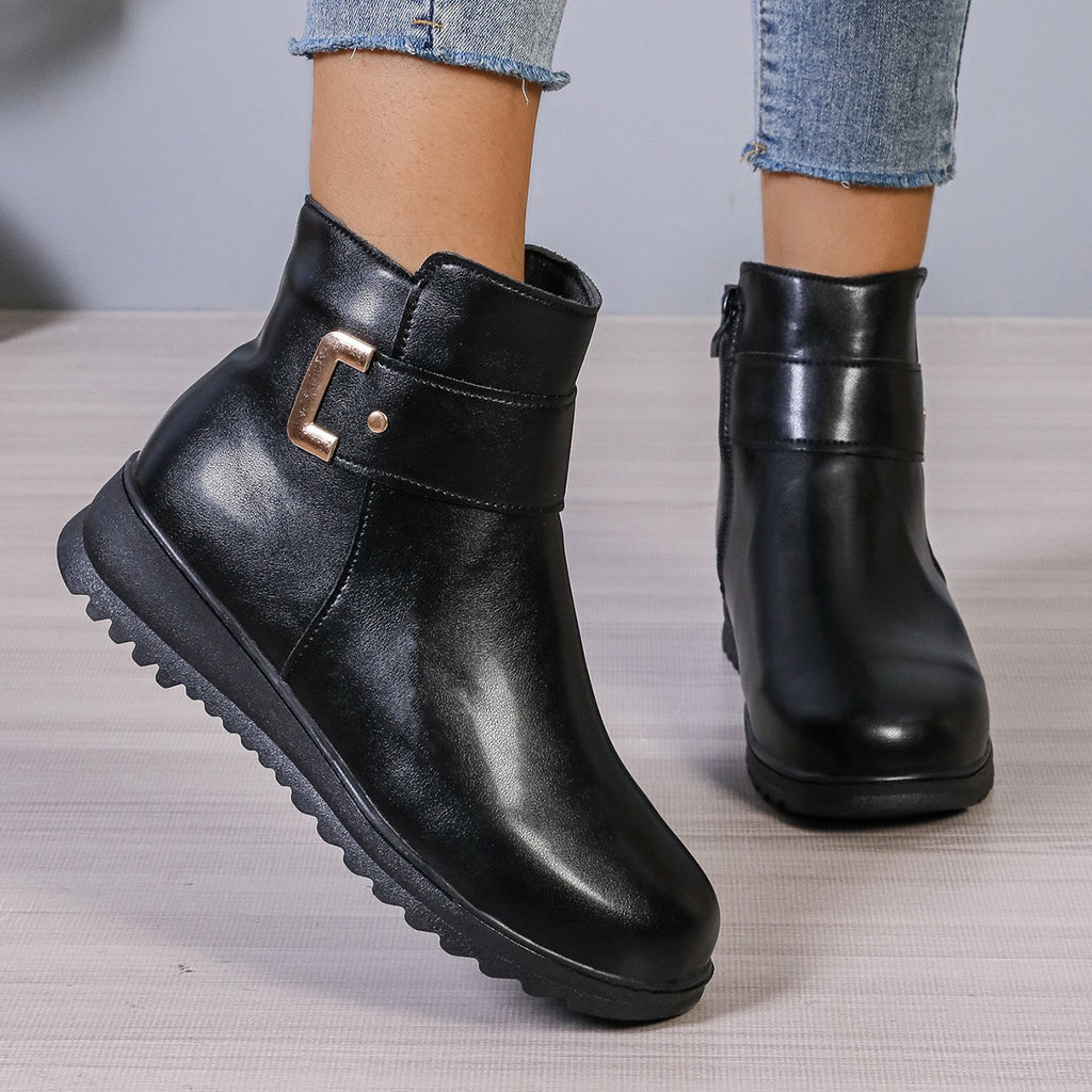 Women’s black winter ankle boots with side zipper and rugged tread sole