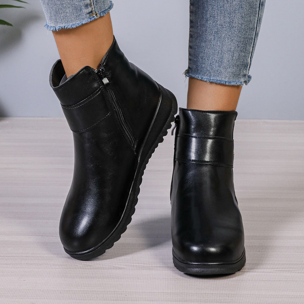 Women’s black ankle boots with side zipper and smooth leather-like finish