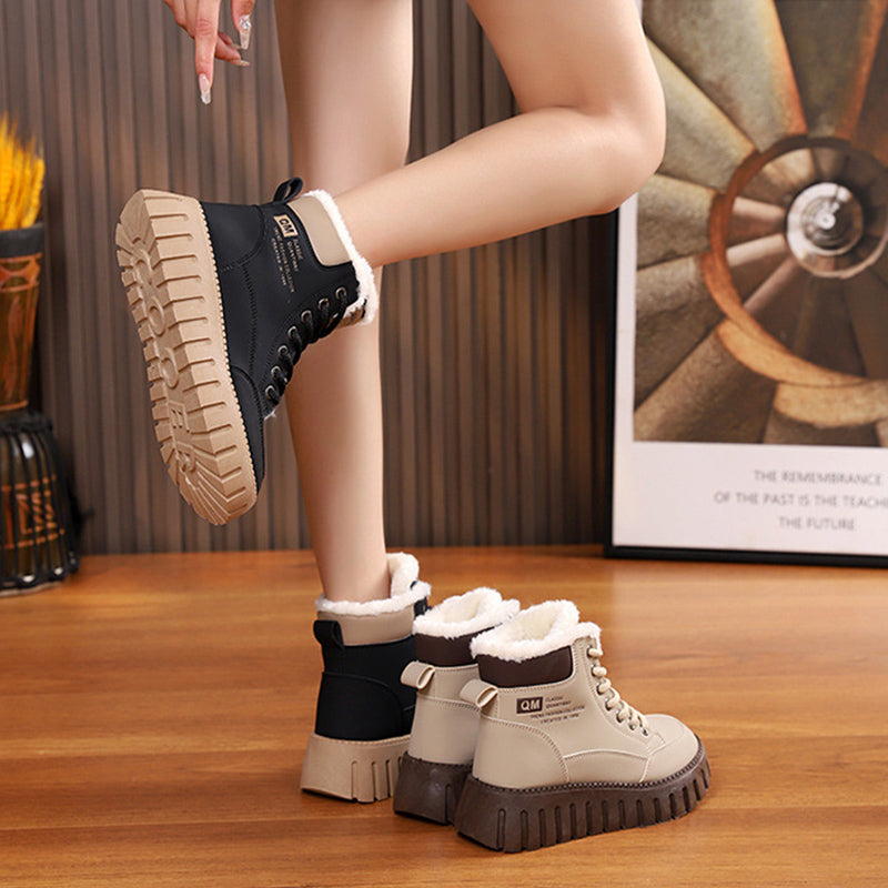 Women’s black lace-up ankle snow boots with sherpa cuffs and platform tread sole