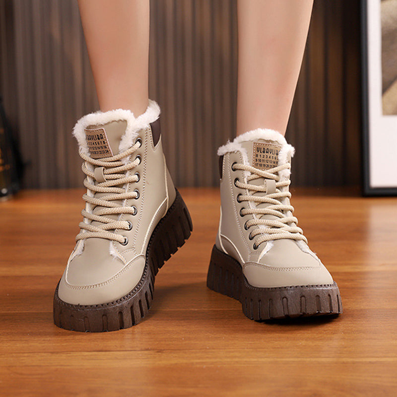 Beige lace-up ankle snow boots with sherpa lining and dark rugged tread sole