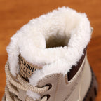 Close-up of beige lace-up snow boot cuff with fluffy sherpa lining and laces
