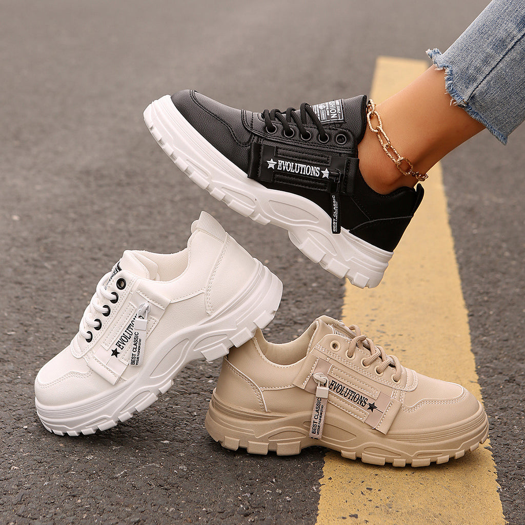 Pair of chunky-sole sneakers: black and cream lace-up with side logo strap