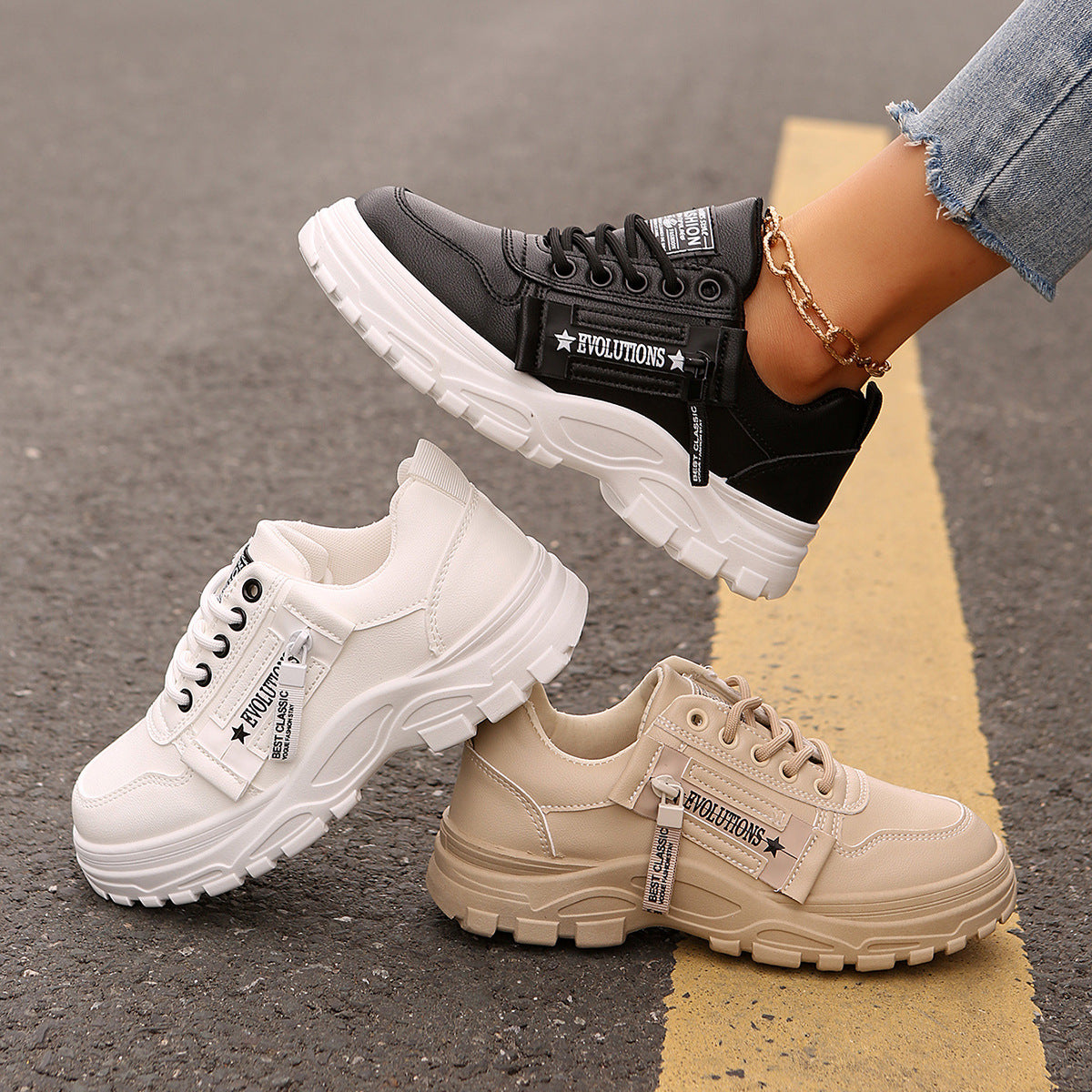 Pair of chunky-sole sneakers: black and cream lace-up with side logo strap