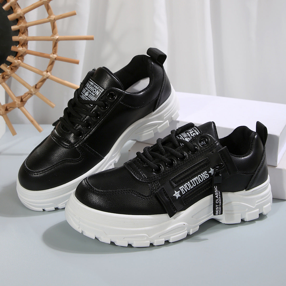 Black lace-up chunky-sole sneakers with side logo strap and white outsole