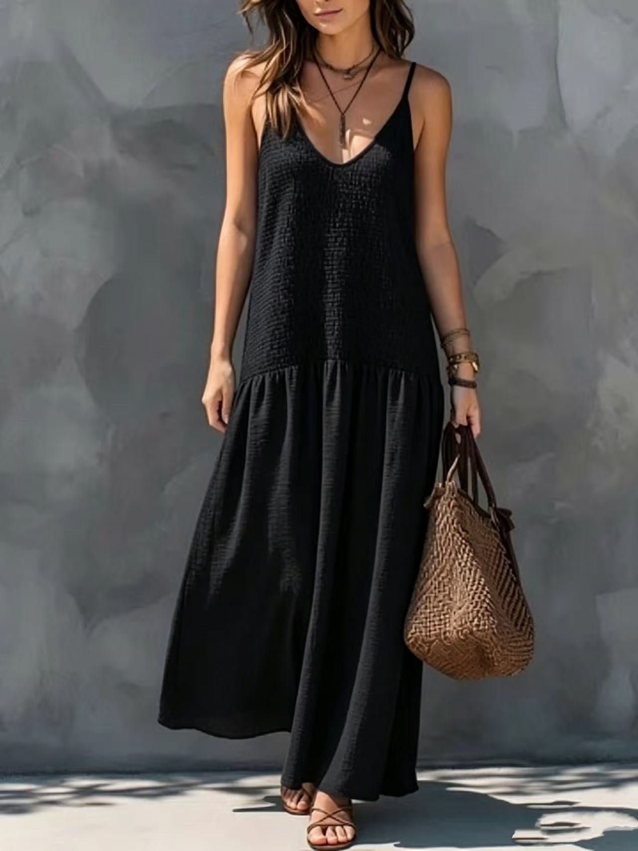 Black tiered maxi sundress with V-neck spaghetti straps and sleeveless silhouette