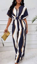 Batwing-sleeve V-neck jumpsuit in navy and white abstract stripes, waist tie