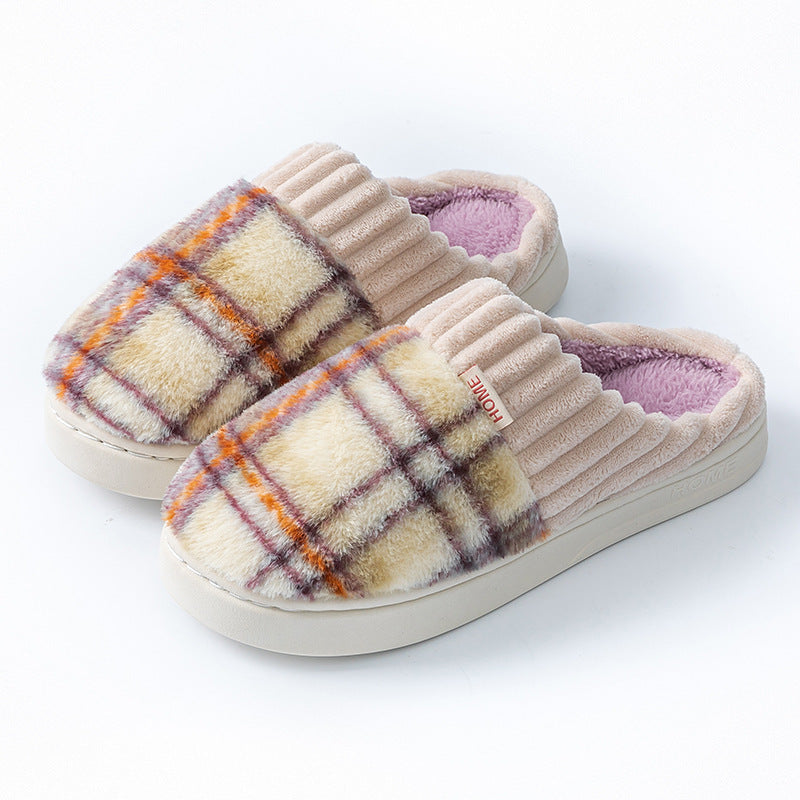 Plaid plush indoor slippers with ribbed cream trim; orange and purple plaid uppers with lavender lining.