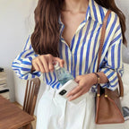Blue and white striped long-sleeve button-up shirt, collared with front placket and cuffs