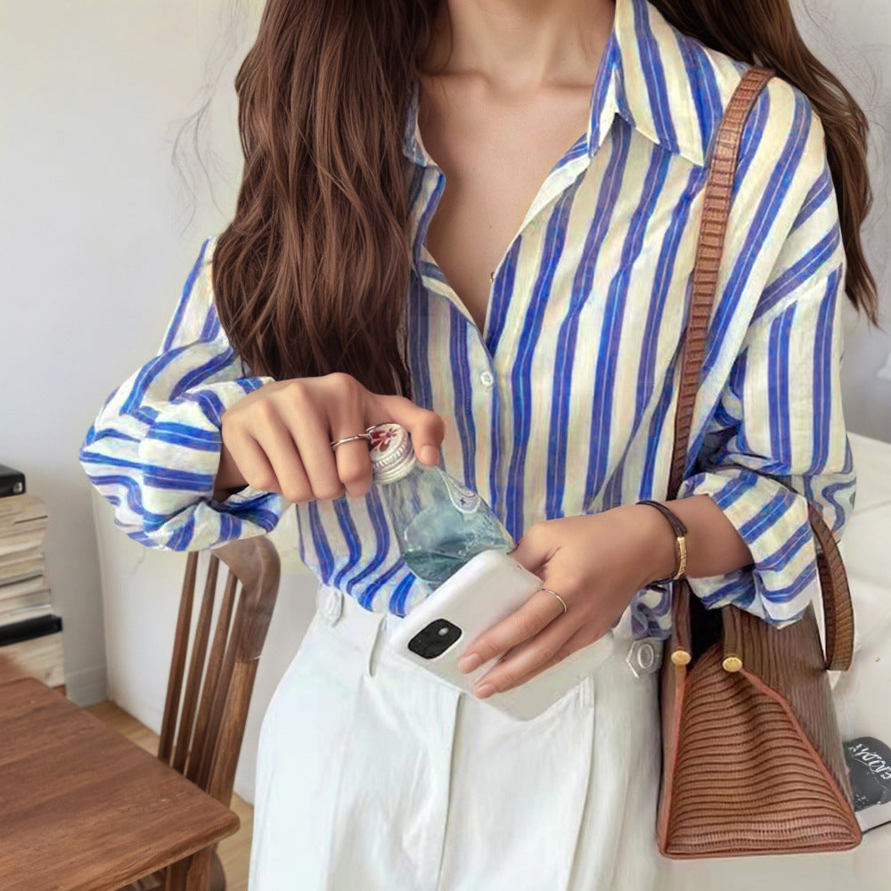 Blue and white striped long-sleeve button-up shirt, collared with front placket and cuffs