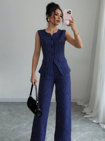 Sleeveless pinstripe button-front jumpsuit with wide legs, navy blue vertical stripes