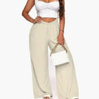 Women’s sleeveless jumpsuit in cream with wide legs, elastic waist, cropped top