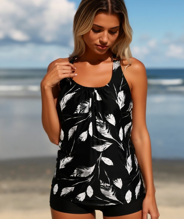 Two-piece casual swimsuit: black leaf-print tank with matching shorts, side view