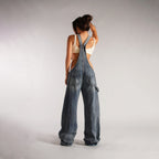 Light blue denim zipper overalls back view with wide legs and large rear pockets