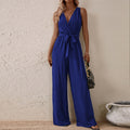 Bright blue high-waist sleeveless jumpsuit with V-neck, tie waist, and wide legs