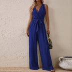 Bright blue high-waist sleeveless jumpsuit with V-neck, tie waist, and wide legs