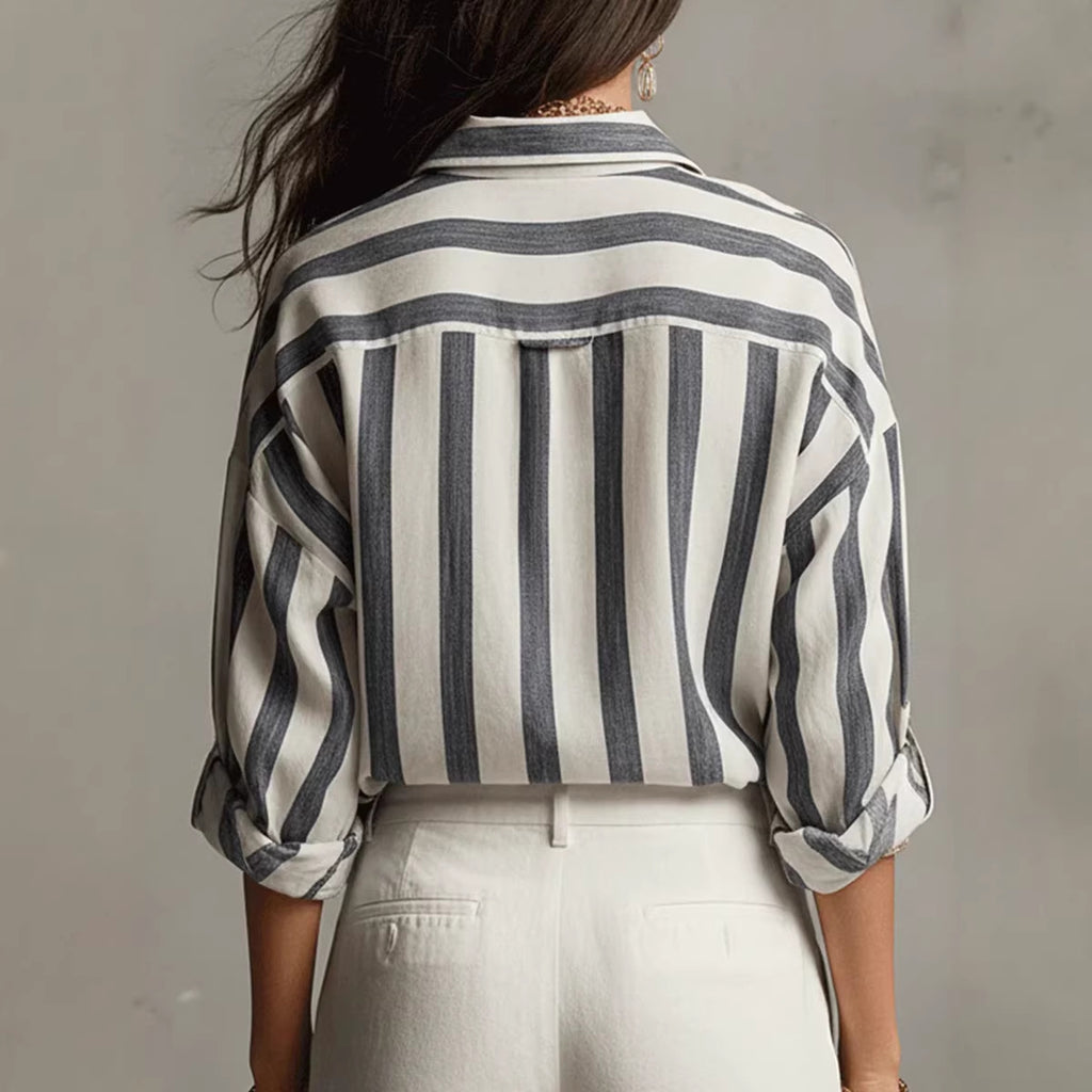 Back view: relaxed-fit collared blouse with vertical navy and white striped pattern