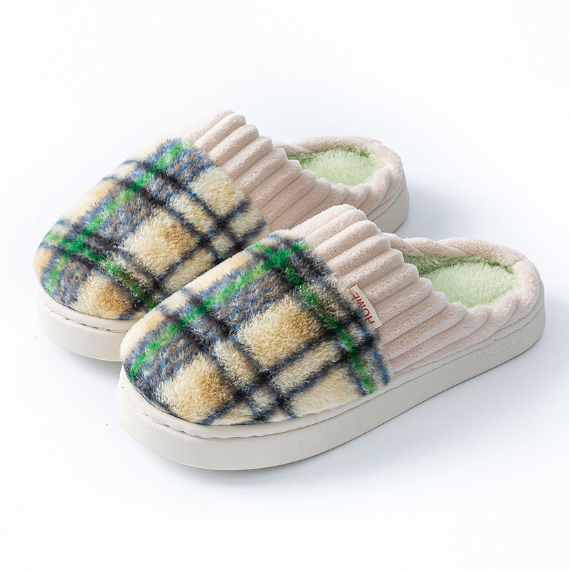 Plaid plush indoor slippers with cream ribbed trim; multicolor plaid uppers and light green lining.