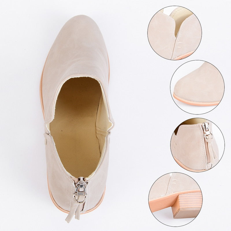 Light beige suede-look ankle boot close-up with side zipper and tassel pull
