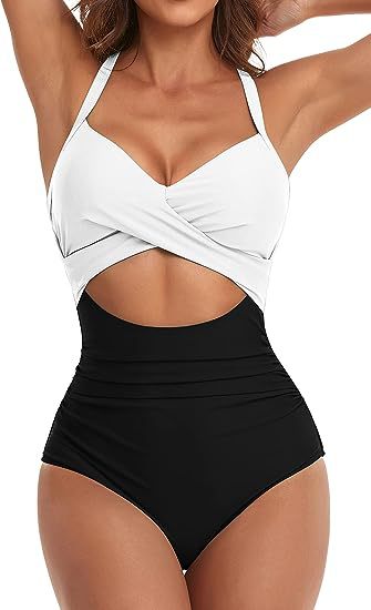 Women's cross one-piece swimsuit in white top and black bottom with waist cutout
