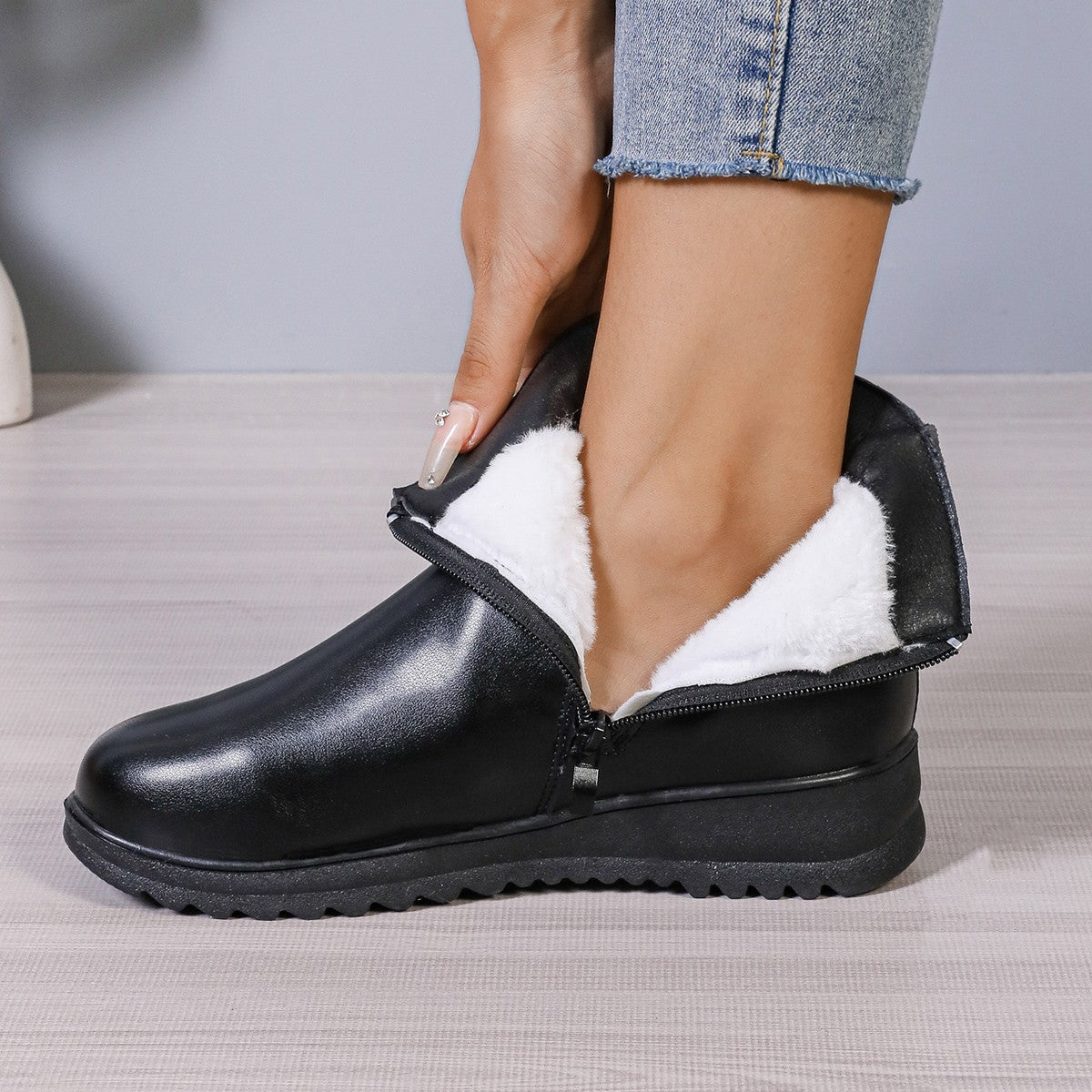 Women’s black ankle boots with side zipper and plush fur lining