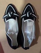 Black woven bow pointed-toe flats with white trim and lace-up detail