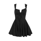 Black corset-style mini dress with lace sleeves, bow front, and flared skirt
