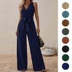 Navy high-waist sleeveless jumpsuit with V-neck, tie waist, and flowy wide legs