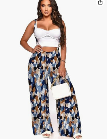 Women's sleeveless jumpsuit with white bodice and navy patterned wide-leg pants