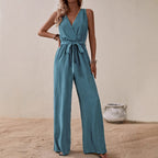 Blue-green high-waist sleeveless jumpsuit with V-neck, tie waist, and wide legs