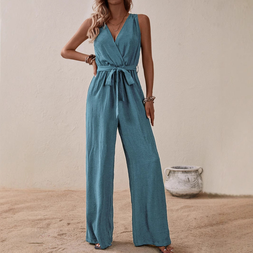 Blue-green high-waist sleeveless jumpsuit with V-neck, tie waist, and wide legs