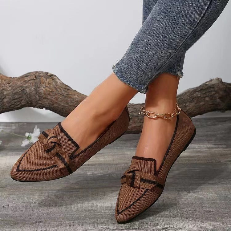 Coffee brown woven bow pointed toe flats with dark trim and buckle-style strap