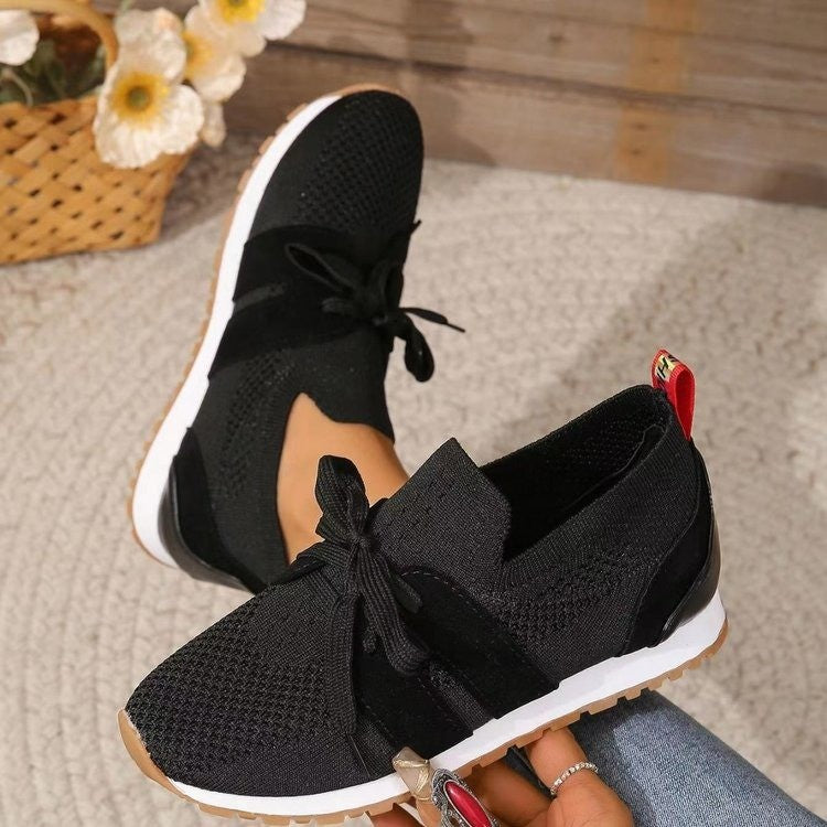 Black breathable mesh wedge walking shoes with lace-up bow and white rubber sole