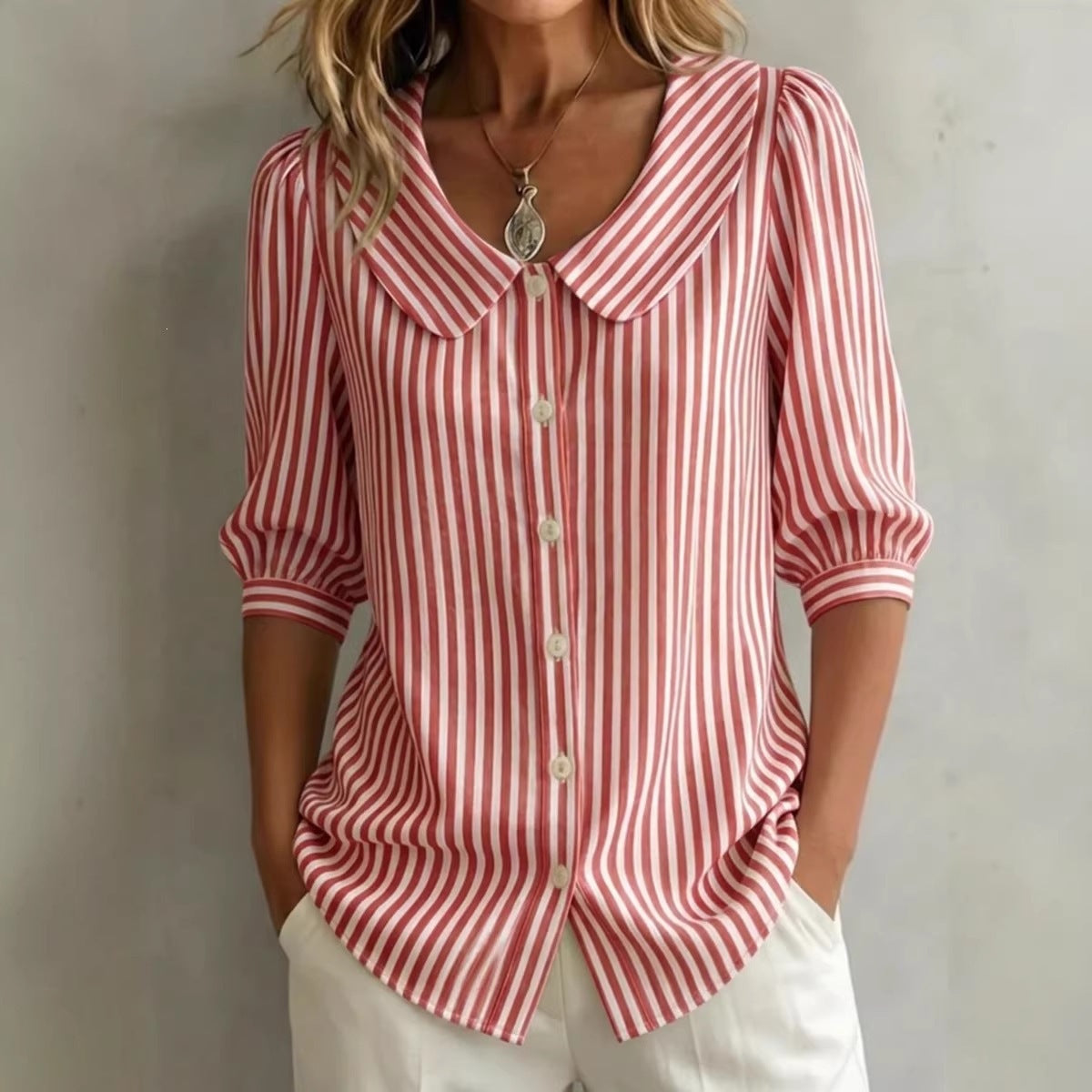 Red-and-white striped V-neck button top with pointed collar and cuffed mid-sleeves