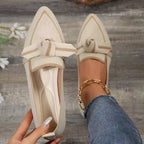 Cream woven bow pointed toe flats with tan trim and bow-tie strap detail
