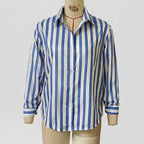 Blue and white striped long-sleeve button-up shirt on mannequin, collared with button placket