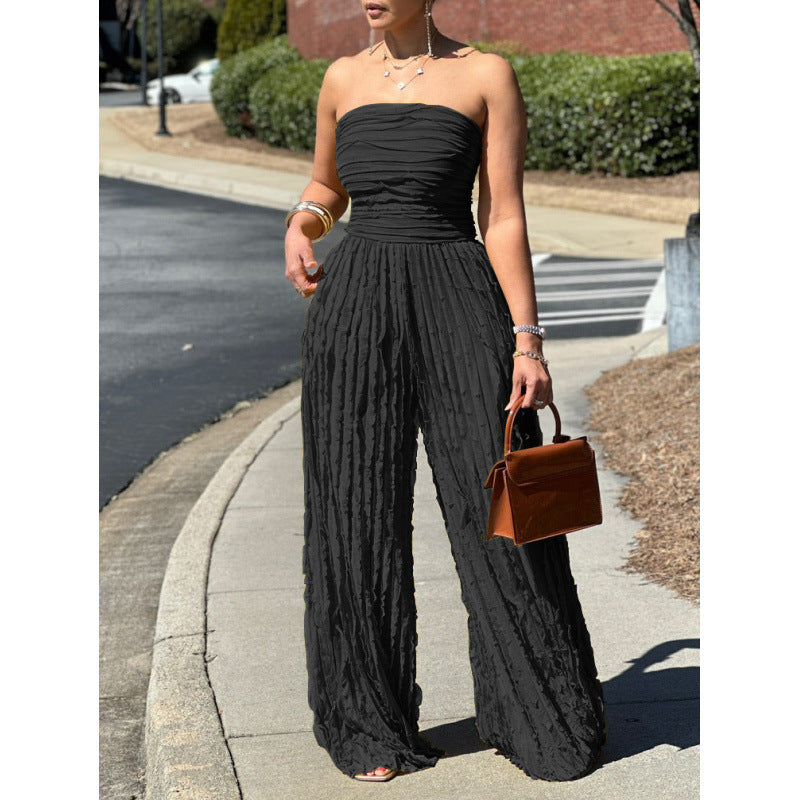 Black strapless wide-leg jumpsuit with gathered bodice and textured vertical crinkle