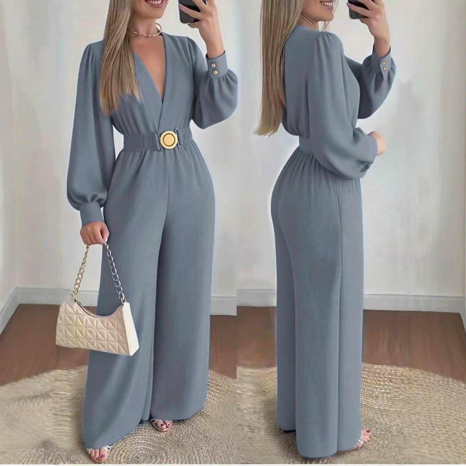 Slate blue deep V-neck slim-fit jumpsuit with long sleeves and round gold belt