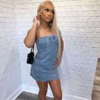 Light blue denim strapless mini dress with frayed hem and backless wrap-style bodice