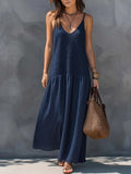 Navy blue tiered maxi sundress with V-neck spaghetti straps and airy skirt